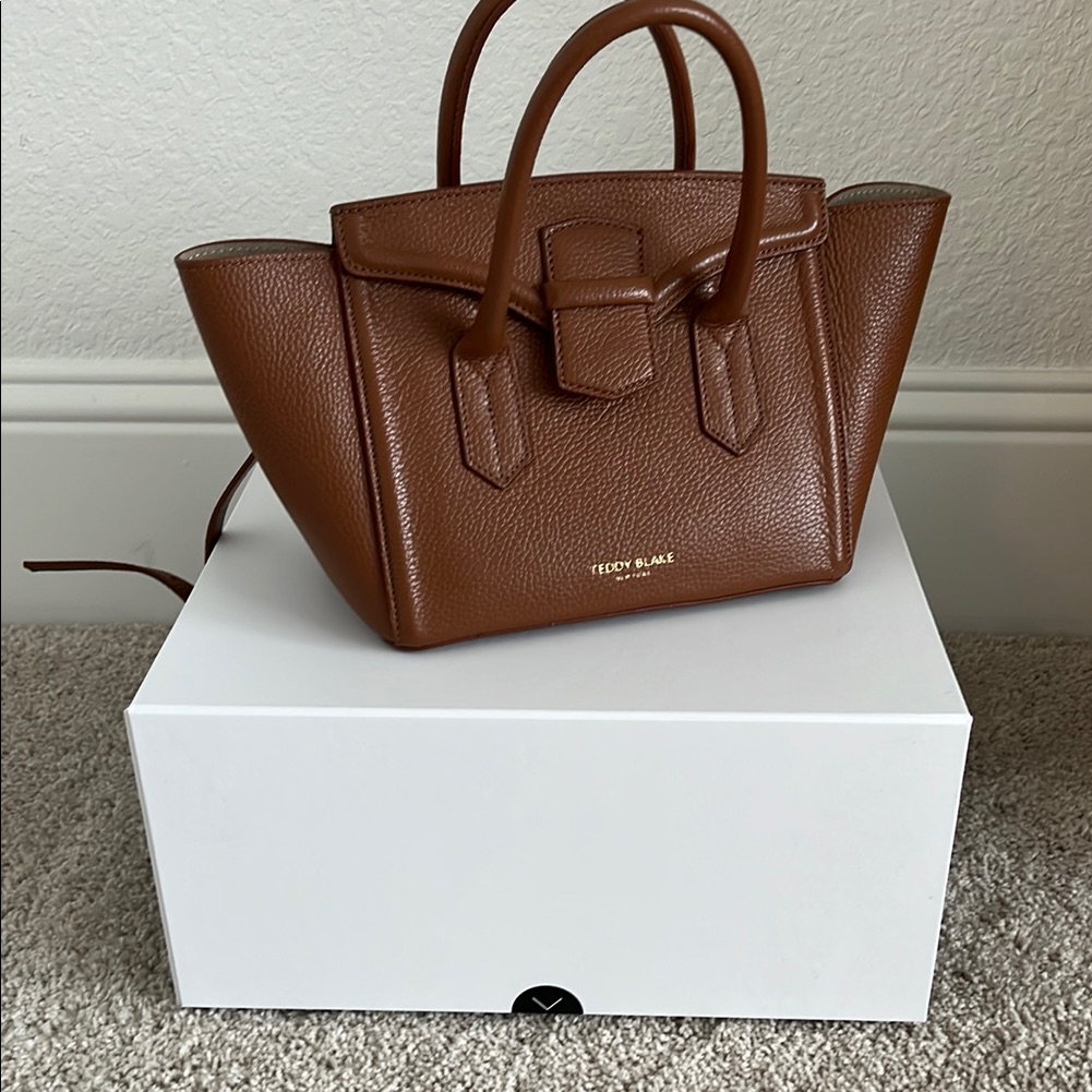 Brown Leather Satchel With Structured Silhouette And Top Handles